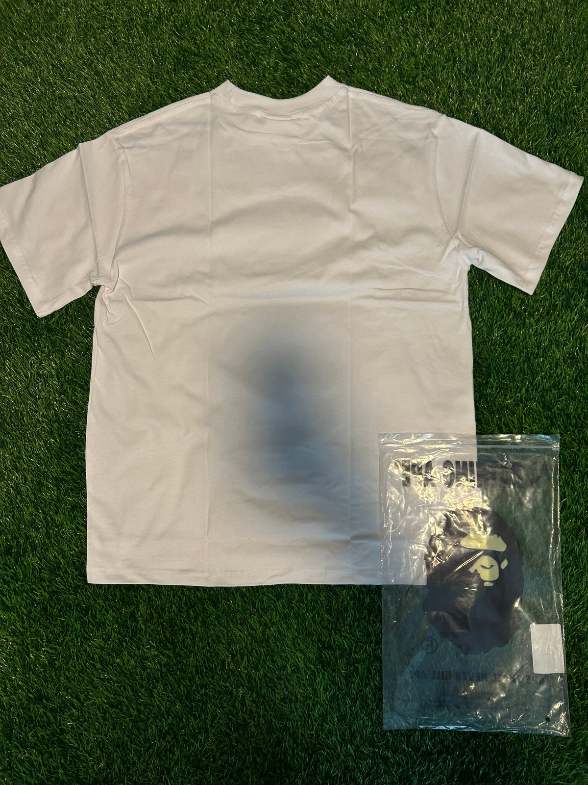 White shrit with green monkey