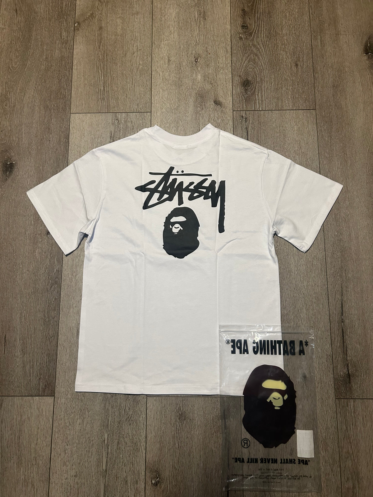 White and stussy Tee